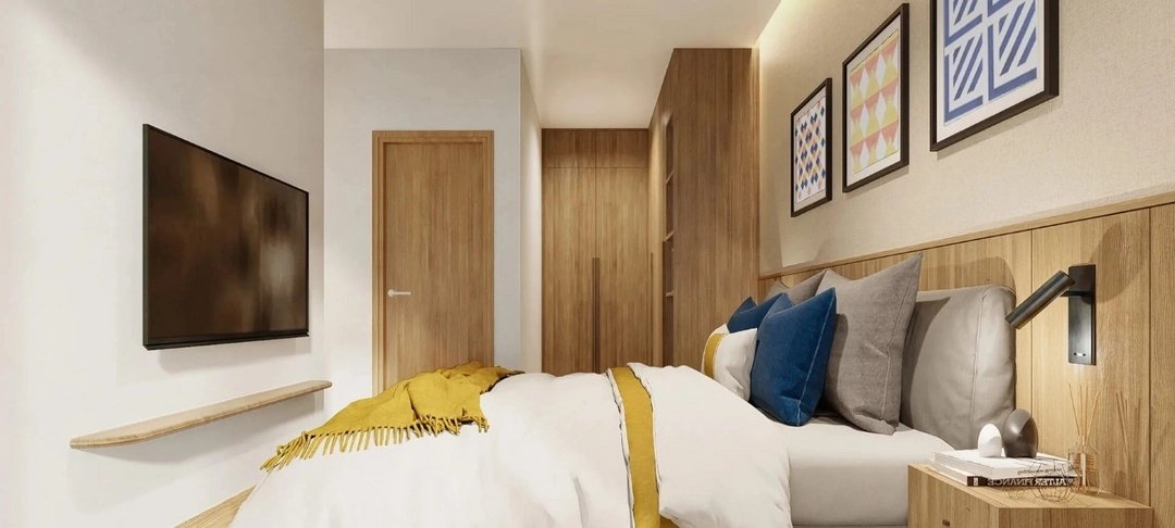 Laguna Lakeside Residences — bedroom with mustard and navy accents